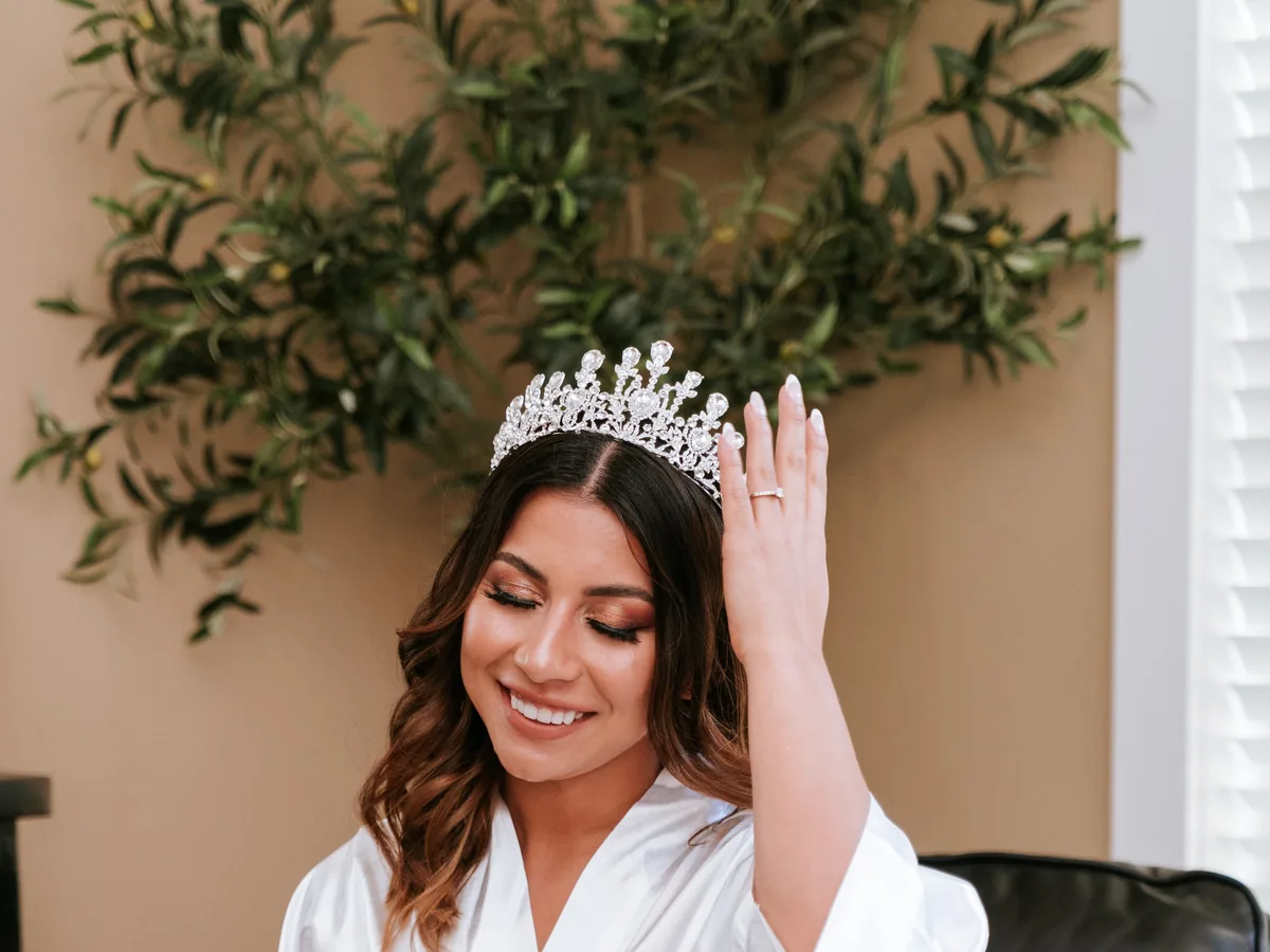 Bride in a robe during the getting-ready hours after her bridal hair and makeup trial
