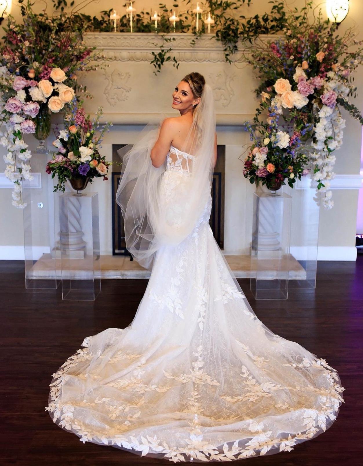 Bride with floral backdrop — DFW wedding