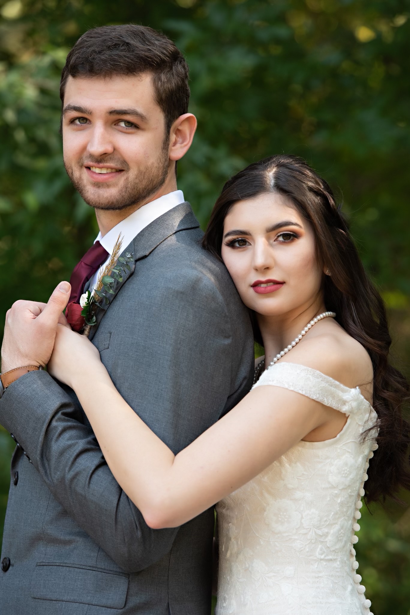 Bridal hair and makeup — bride and groom portrait